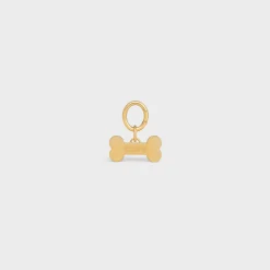 Bone dog medal in brass