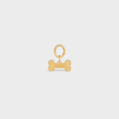 Bone dog medal in brass