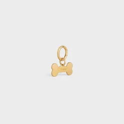 Bone dog medal in brass