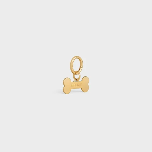 Bone dog medal in brass