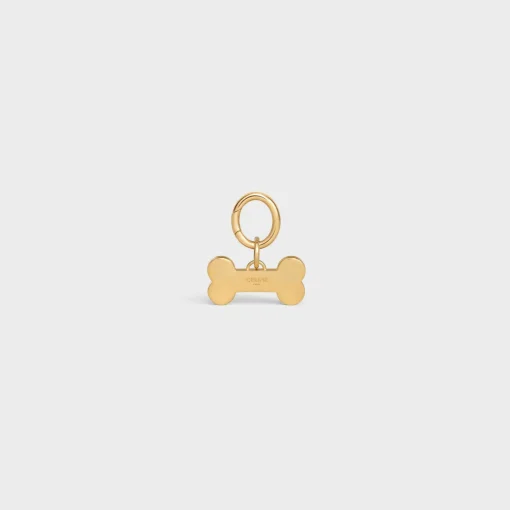 Bone dog medal in brass