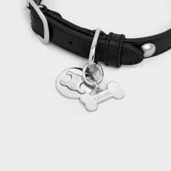 Bone dog medal in brass