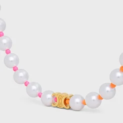Celine Plage Pearl Necklace in Brass with Gold Finish and Resin Pearls