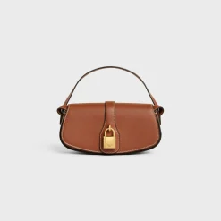CLUTCH ON STRAP TABOU in Smooth calfskin