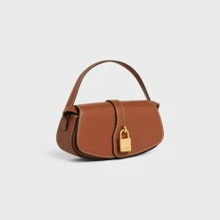 CLUTCH ON STRAP TABOU in Smooth calfskin