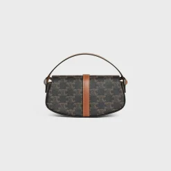 CLUTCH ON STRAP TABOU in Triomphe canvas and calfskin