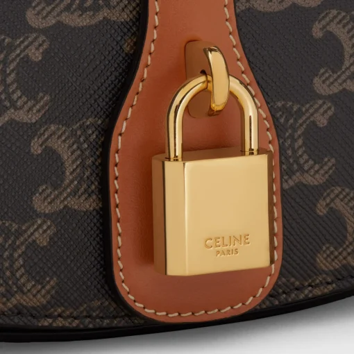 CLUTCH ON STRAP TABOU in Triomphe canvas and calfskin