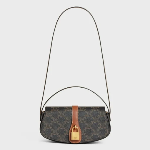 CLUTCH ON STRAP TABOU in Triomphe canvas and calfskin