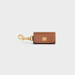 DOG BAGS HOLDER IN SMOOTH CALFSKIN WITH PYRAMID STUDS