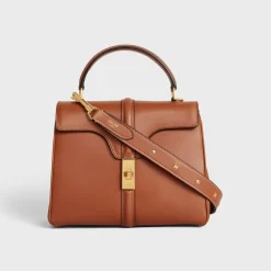 LONG STRAP in smooth CALFSKIN WITH TRIOMPHE STUDS with Gold Finishing