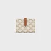 Medium strap wallet in Triomphe Canvas and Lambskin