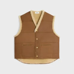 oversized sleeveless jacket in curly lambskin