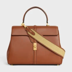 STRAP in raffia effect textile and calfskin with GOLD FINISHING
