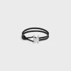 Triomphe Clasp Bracelet in Calfskin and Brass with Rhodium Finish