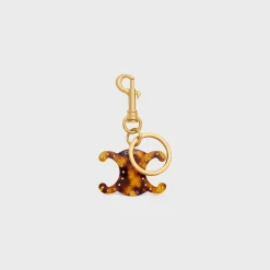 TRIOMPHE KEYRING CHARM in PLEXIGLASS with GOLD FINISHING