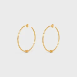 Triomphe Large Hoops in Brass with Gold Finish