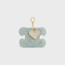 TRIOMPHE pom-pom keyring with HEART in SHEARLING AND CALFSKIN with GOLD FINISHING