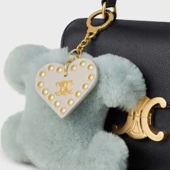 TRIOMPHE pom-pom keyring with HEART in SHEARLING AND CALFSKIN with GOLD FINISHING