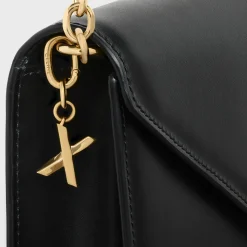 X CHARM in Brass